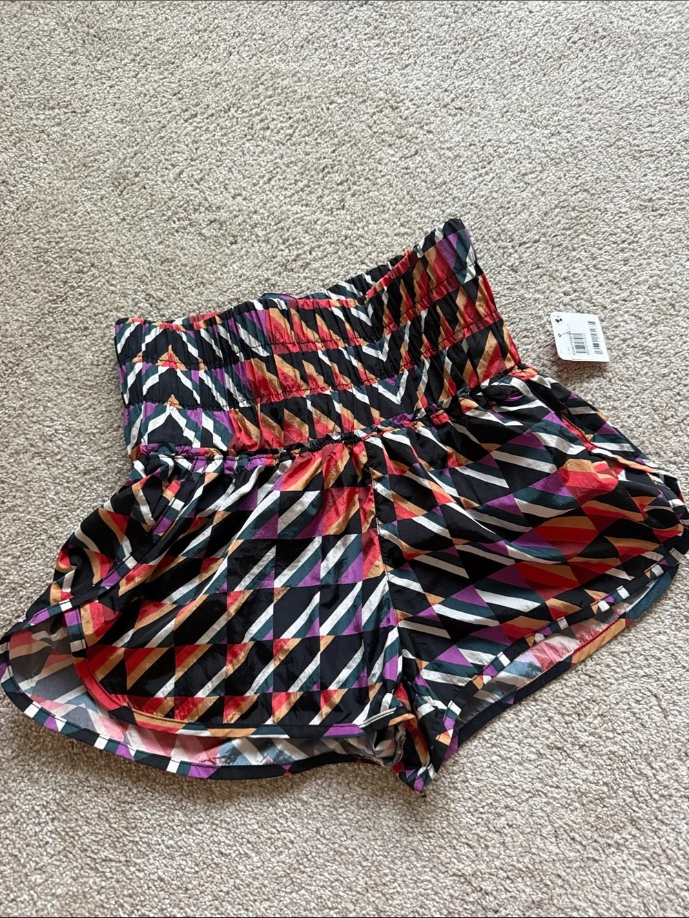 NWT Free people movement Orange crush combo print athletic shorts size Xs